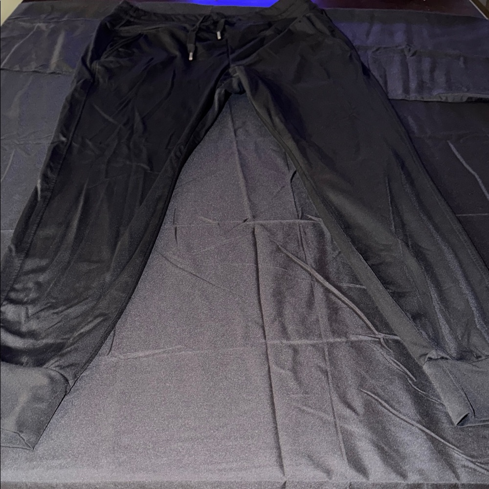 Women’s black Halara leggings with drawstring and pockets. Super comfortable.